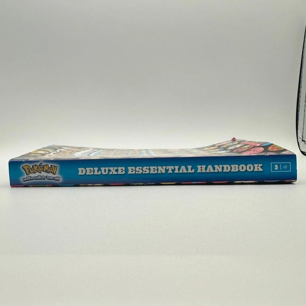Pokemon Deluxe Essential Handbook Scholastic 700+ Pokemon Guide 2015 Paperback